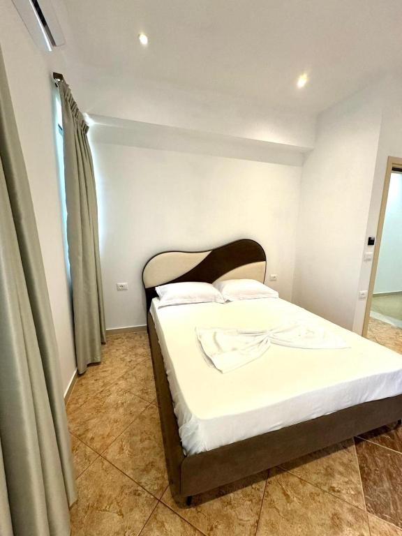 Postel nebo postele na pokoji v ubytování Hotel Balili