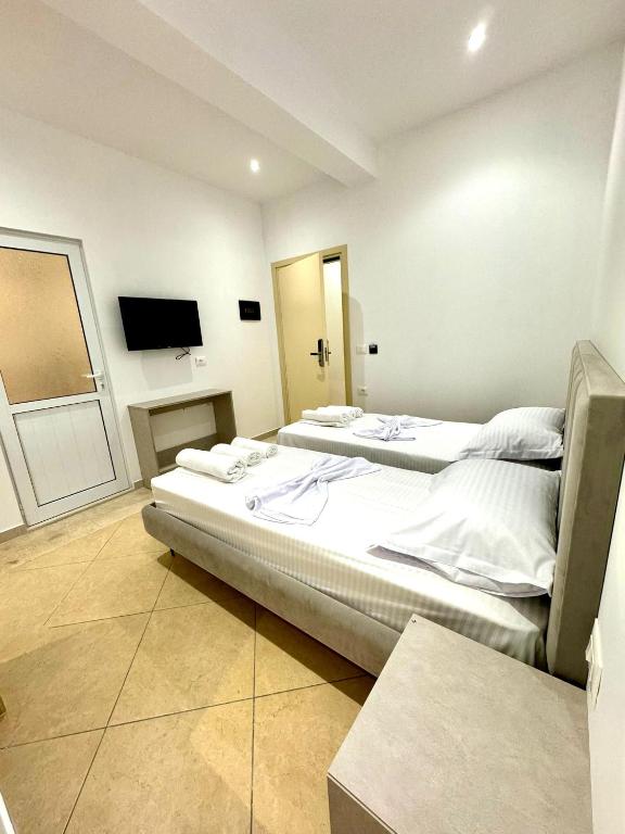 Postel nebo postele na pokoji v ubytování Hotel Balili