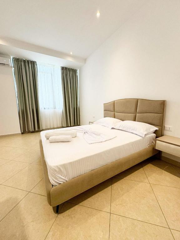 Postel nebo postele na pokoji v ubytování Hotel Balili