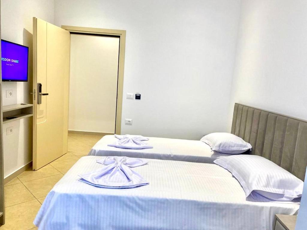 Postel nebo postele na pokoji v ubytování Hotel Balili