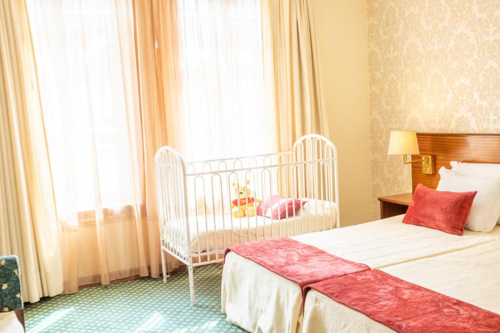 Uma cama ou camas num quarto em Hotel Eurosol Gouveia