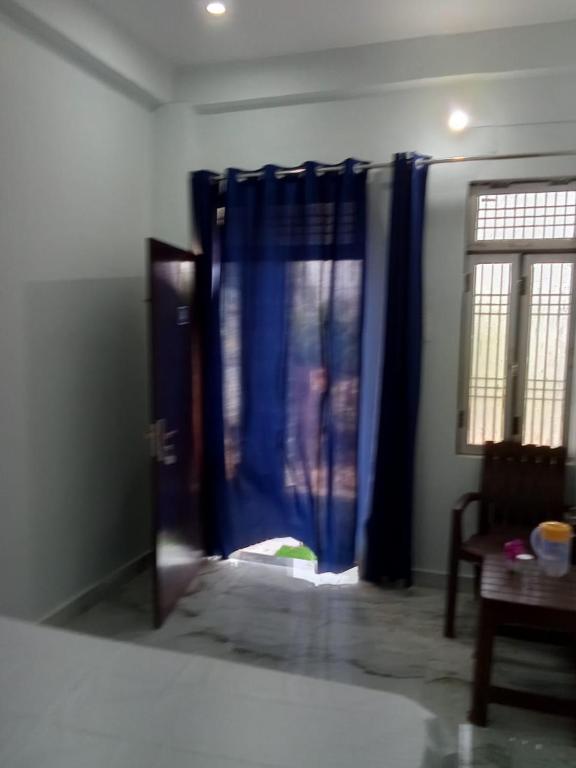 Postel nebo postele na pokoji v ubytování Raghubir Nikunj Homestay