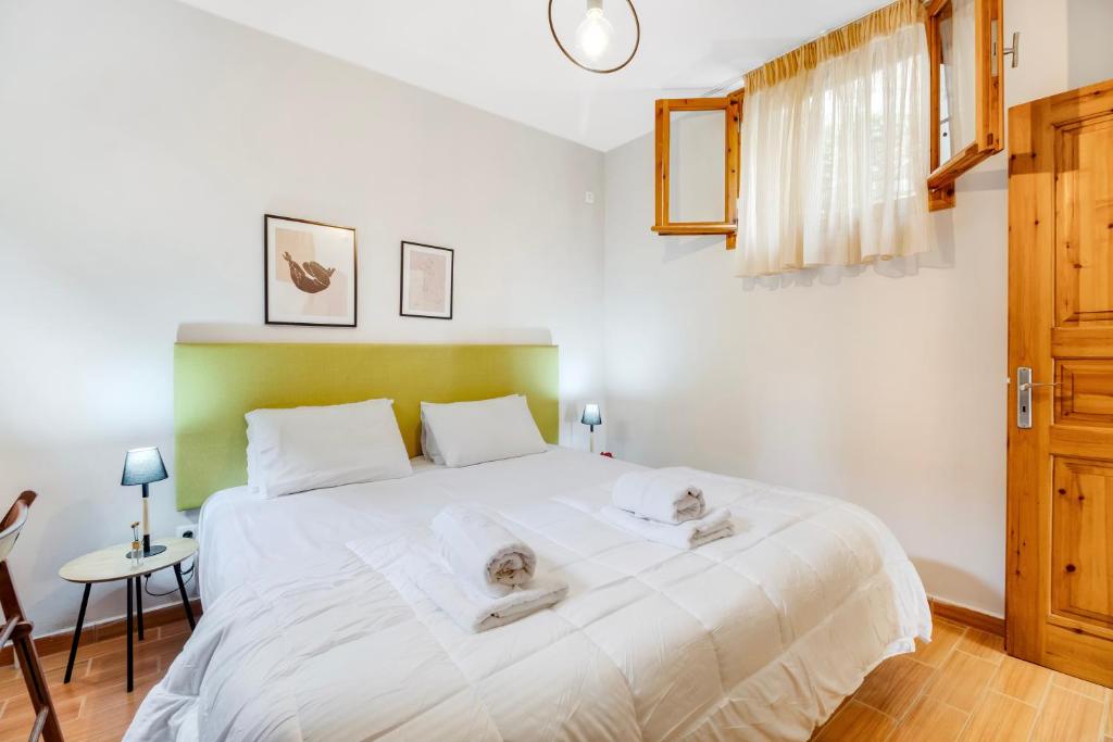 Postel nebo postele na pokoji v ubytování TheaSEA house