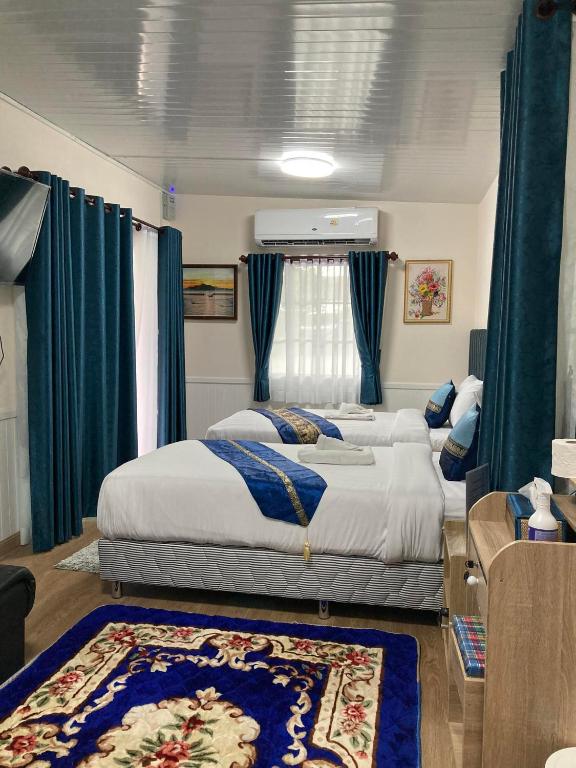 Voodi või voodid majutusasutuse วิวธารารีสอร์ท (ViewThara Resort) toas