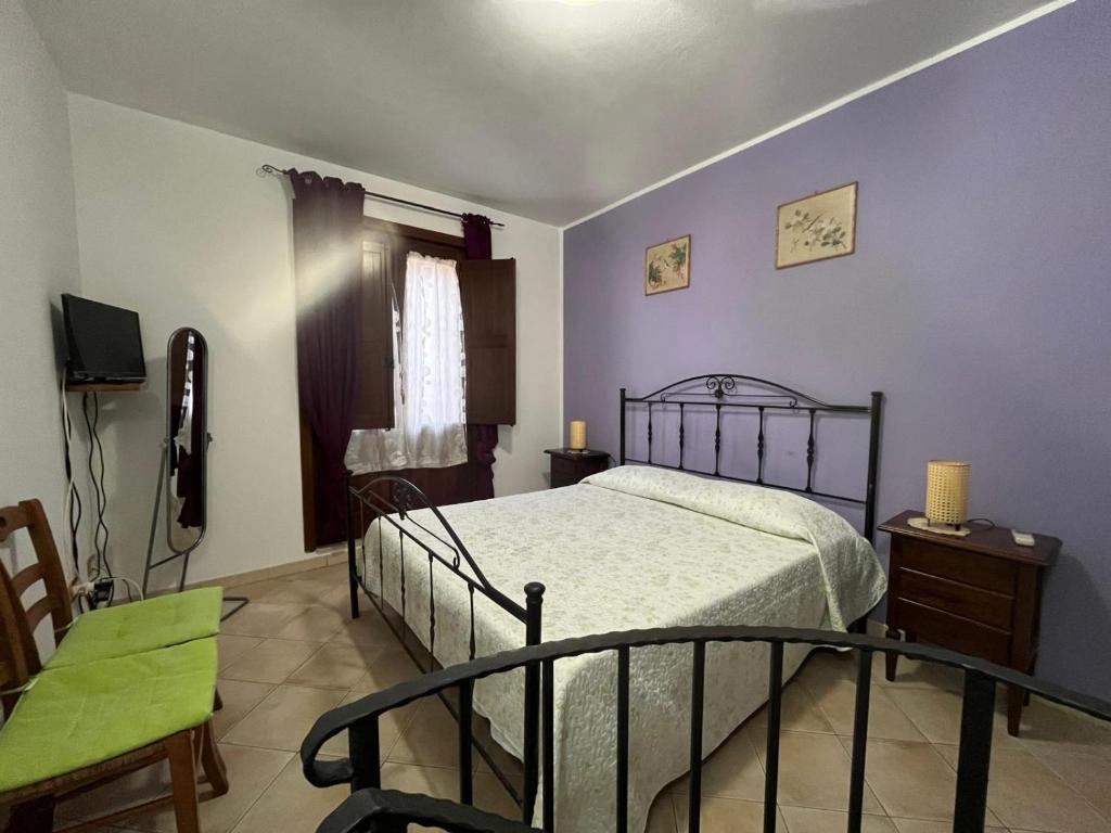 Ένα ή περισσότερα κρεβάτια σε δωμάτιο στο Casa Vacanze Letizia