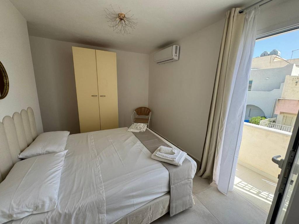 Postel nebo postele na pokoji v ubytování Panima Rooms