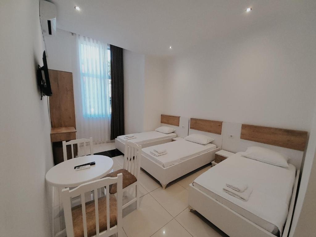 Postel nebo postele na pokoji v ubytování Hotel Restaurant Univers