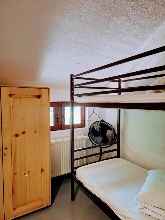Postel nebo postele na pokoji v ubytování Downtown Hostel