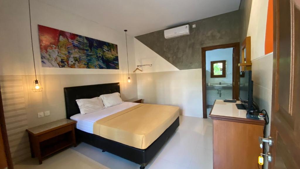 Postel nebo postele na pokoji v ubytování Sandat Hotel Legian