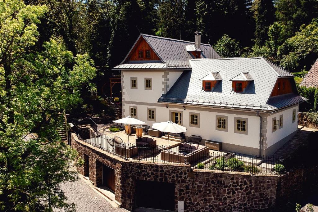 an aerial view of a large white house at Resla Residence I, II, in Banská Štiavnica