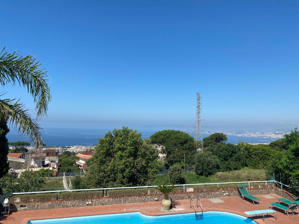 a swimming pool with a view of the ocean at Il Giardinetto - Volcano in Ercolano