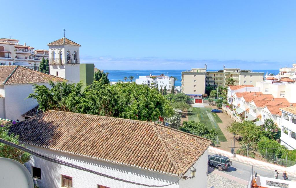 an aerial view of a city with buildings and the ocean at Cozy Apartment In Almunécar in Almuñécar