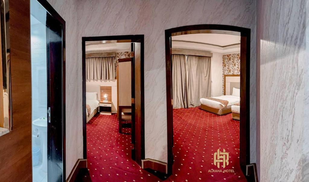 Postel nebo postele na pokoji v ubytování Al Rahaa Furnished Aparthotel