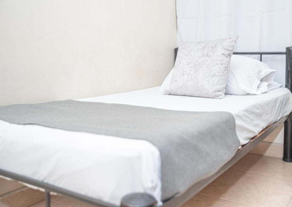 Postel nebo postele na pokoji v ubytování Hotel Conquistadores