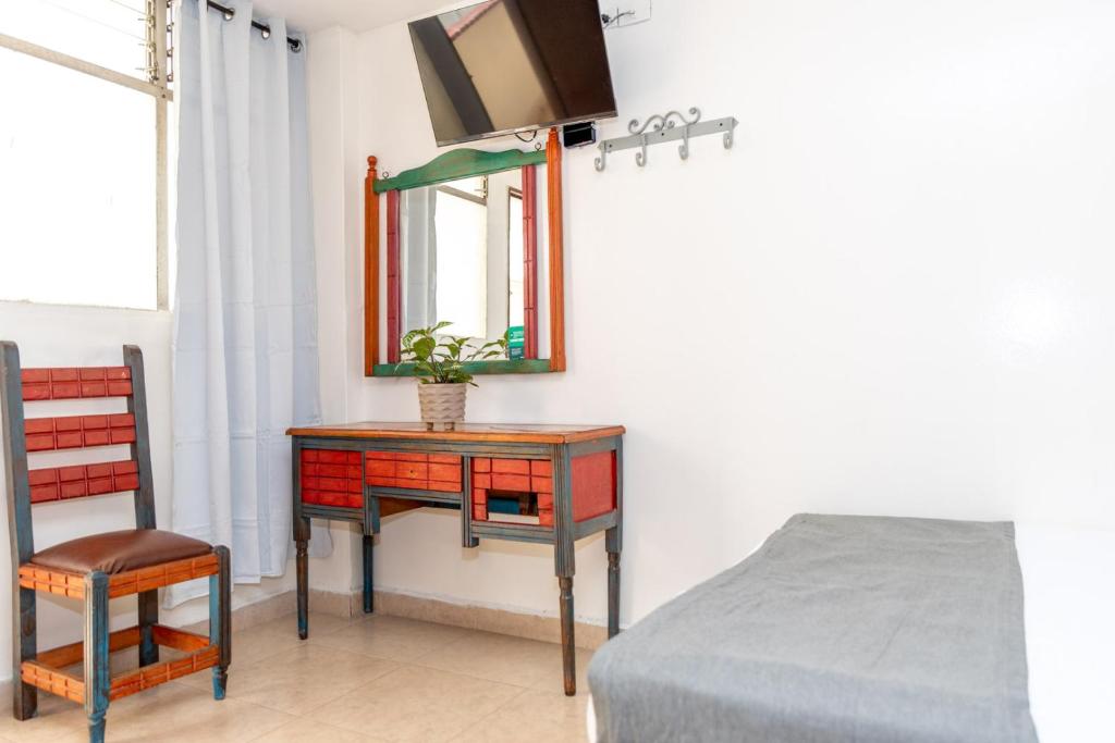 Postel nebo postele na pokoji v ubytování Hotel Conquistadores
