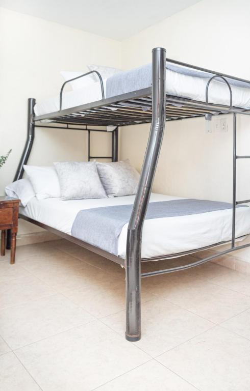 Postel nebo postele na pokoji v ubytování Hotel Conquistadores