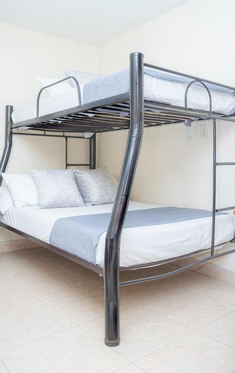 Postel nebo postele na pokoji v ubytování Hotel Conquistadores