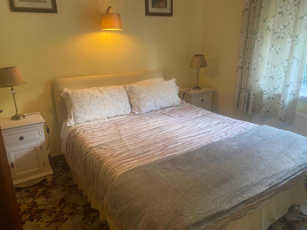 Postel nebo postele na pokoji v ubytování Palm Grove B&B