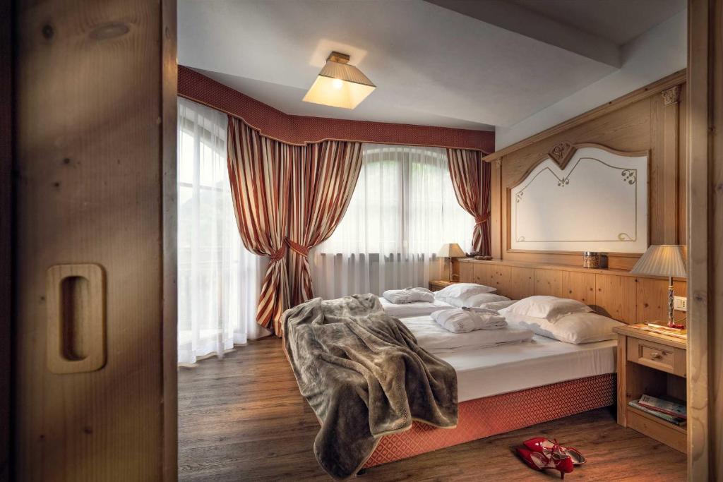 Postel nebo postele na pokoji v ubytování Hotel Alte Mühle 4 Stelle