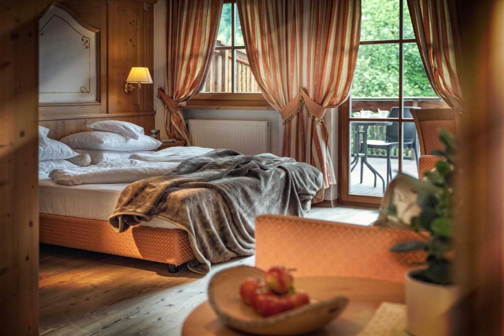 Postel nebo postele na pokoji v ubytování Hotel Alte Mühle 4 Stelle