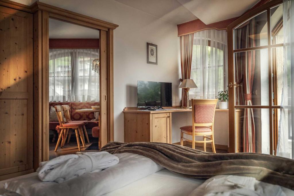 TV a/nebo společenská místnost v ubytování Hotel Alte Mühle 4 Stelle