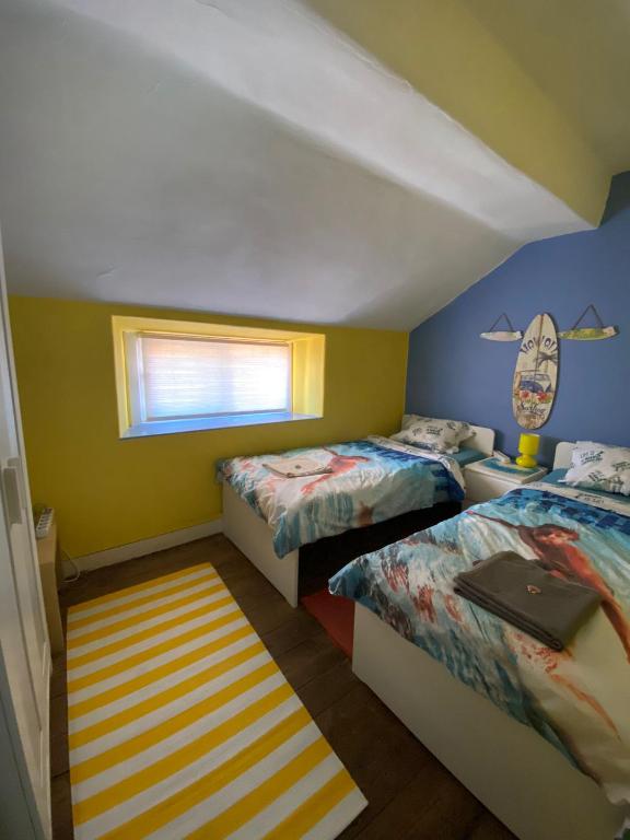 Postel nebo postele na pokoji v ubytování The Paintshop Hostel