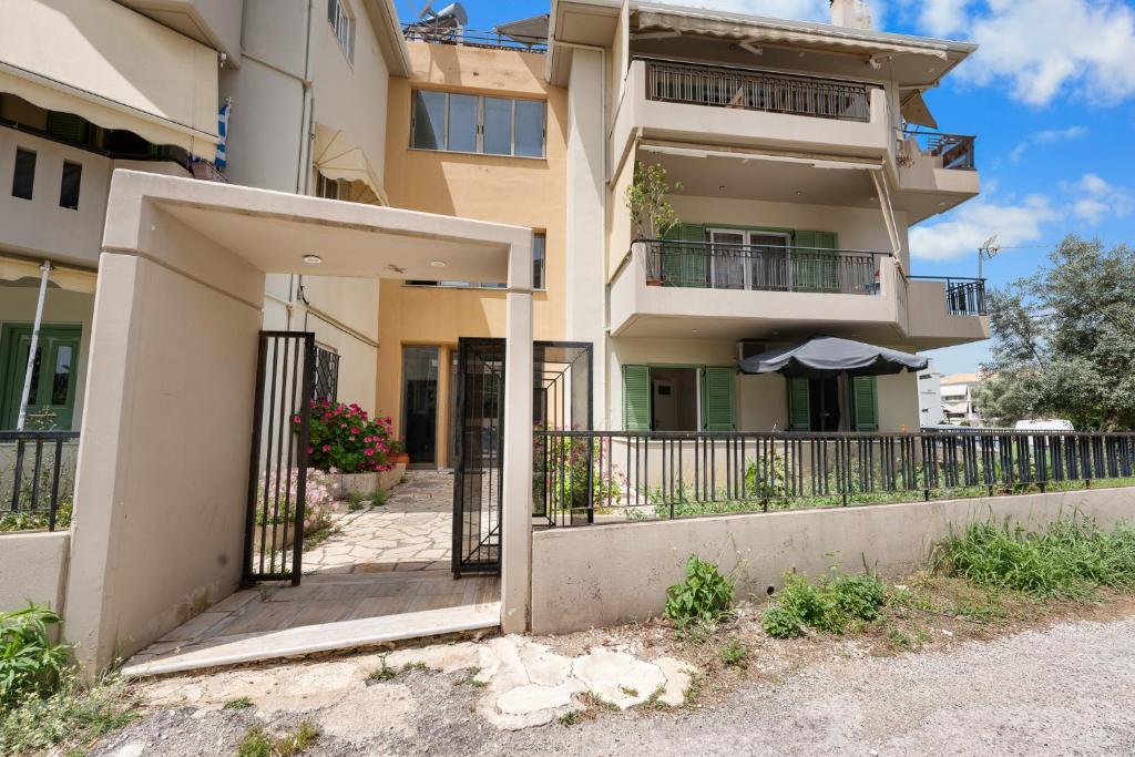 an external view of a building with a balcony at Abatis CityHome in Lefkada