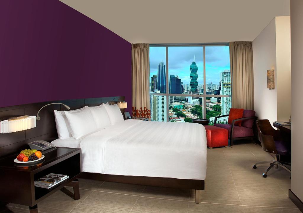 Postel nebo postele na pokoji v ubytování Megapolis Hotel Panama