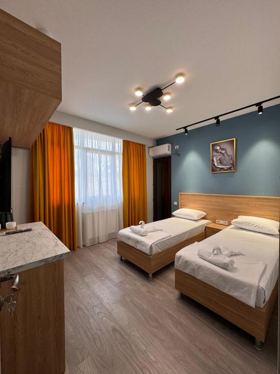 Postel nebo postele na pokoji v ubytování Hotel Boutique Adam