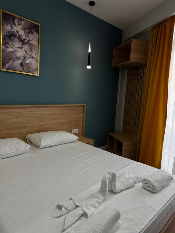 Postel nebo postele na pokoji v ubytování Hotel Boutique Adam