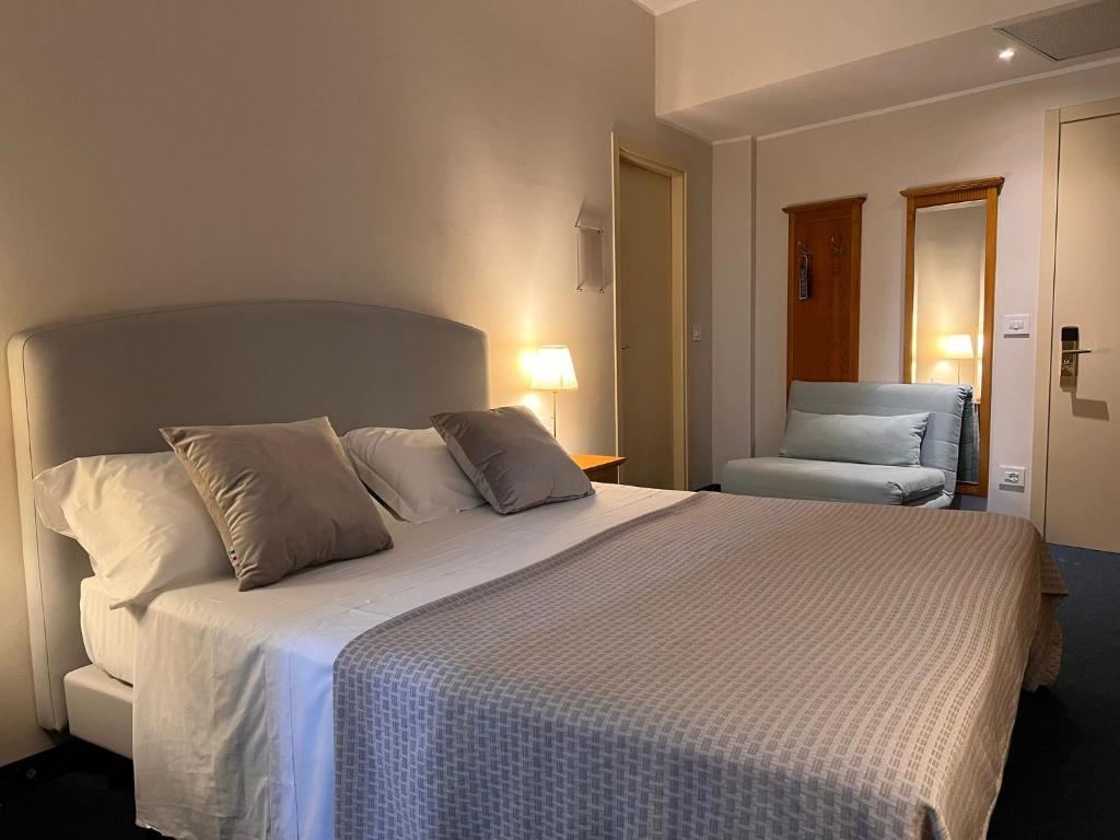 Posteľ alebo postele v izbe v ubytovaní Hotel Dorè