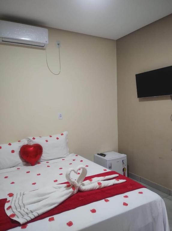Cama ou camas em um quarto em Pousada Vista da Serra - Suzart