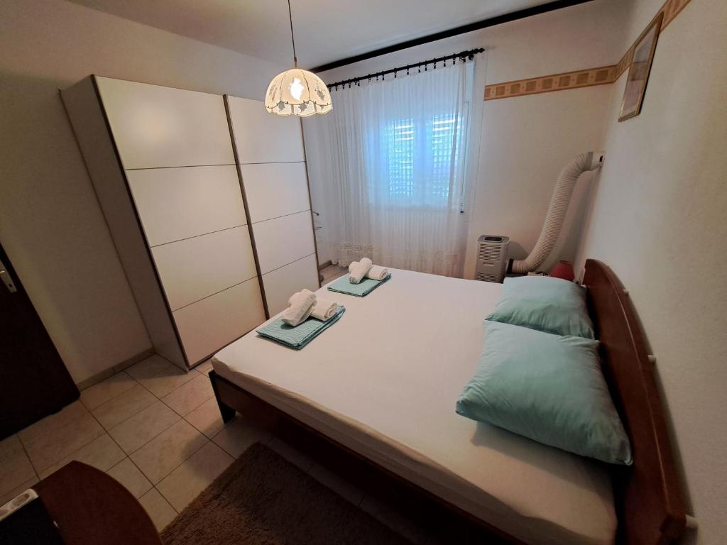 Postel nebo postele na pokoji v ubytování Apartman LETI