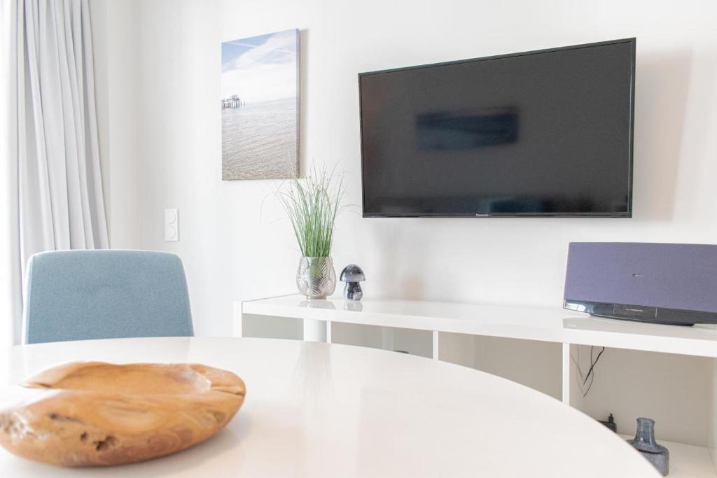 TV a/nebo společenská místnost v ubytování Ferienwohnung 30 Grad