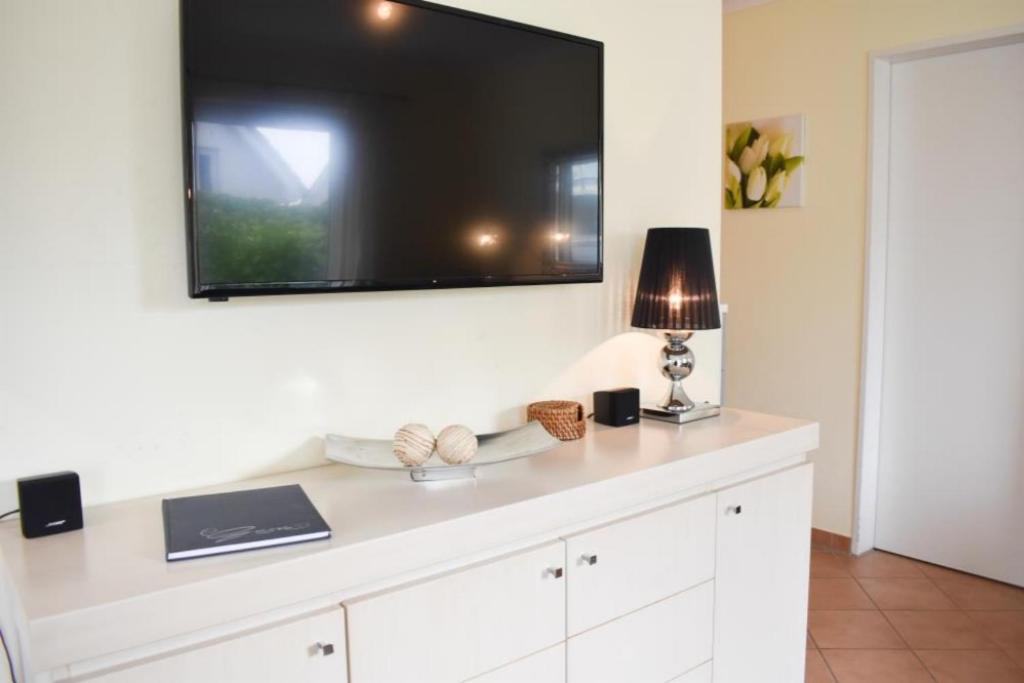TV a/nebo společenská místnost v ubytování Ferienwohnung Seestern