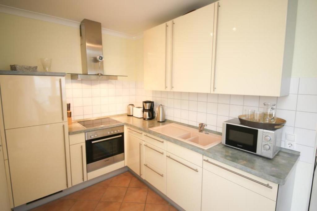 Kuchyň nebo kuchyňský kout v ubytování Ferienwohnung Seestern