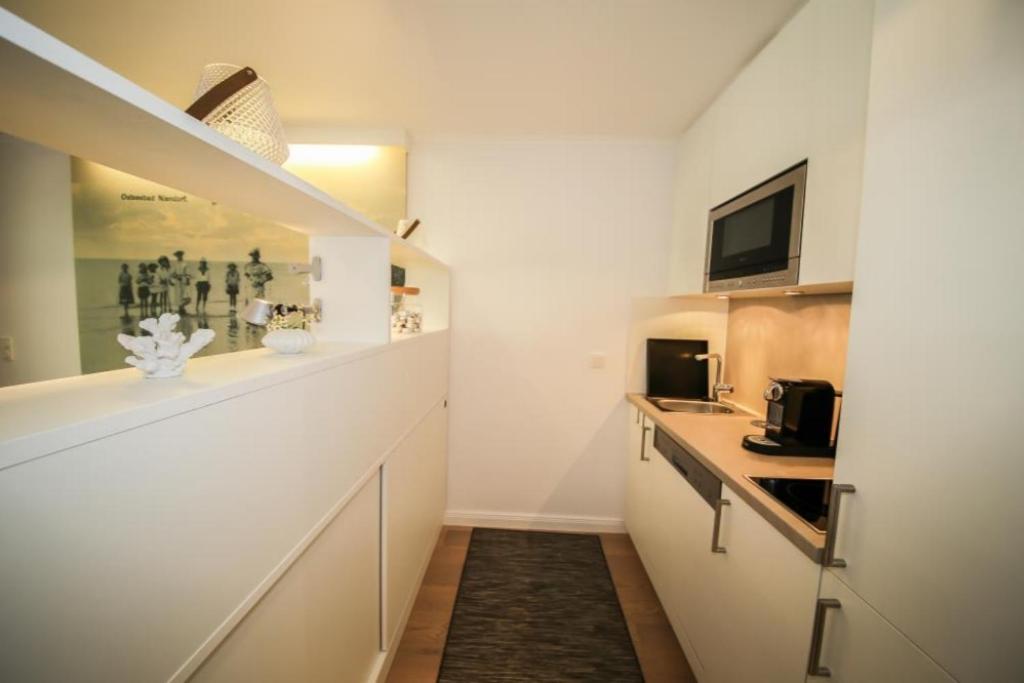 Kuchyň nebo kuchyňský kout v ubytování Ferienwohnung Am Strand