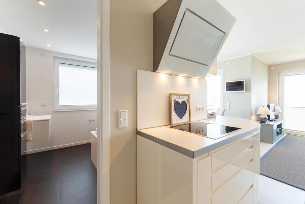 Kuchyň nebo kuchyňský kout v ubytování Ferienwohnung Beach 66 in Haffkrug