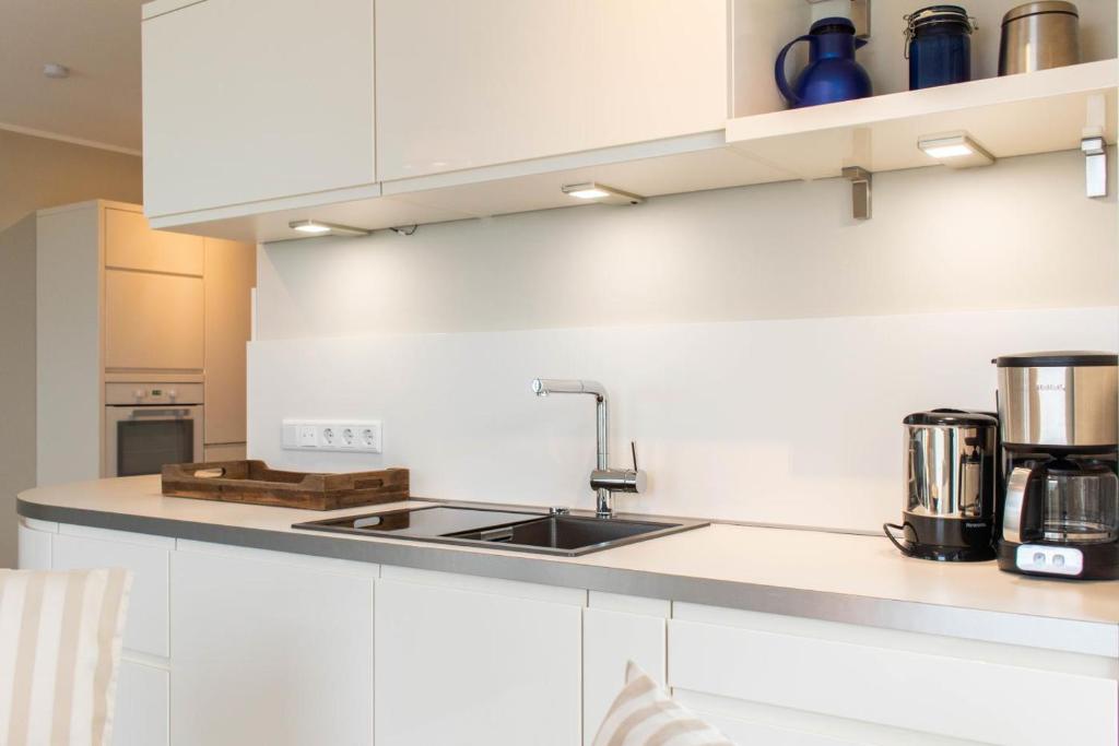 Kuchyň nebo kuchyňský kout v ubytování Ferienwohnung Beach 66 in Haffkrug