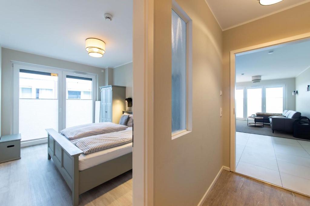 Postel nebo postele na pokoji v ubytování Ferienwohnung Beach 66 in Haffkrug