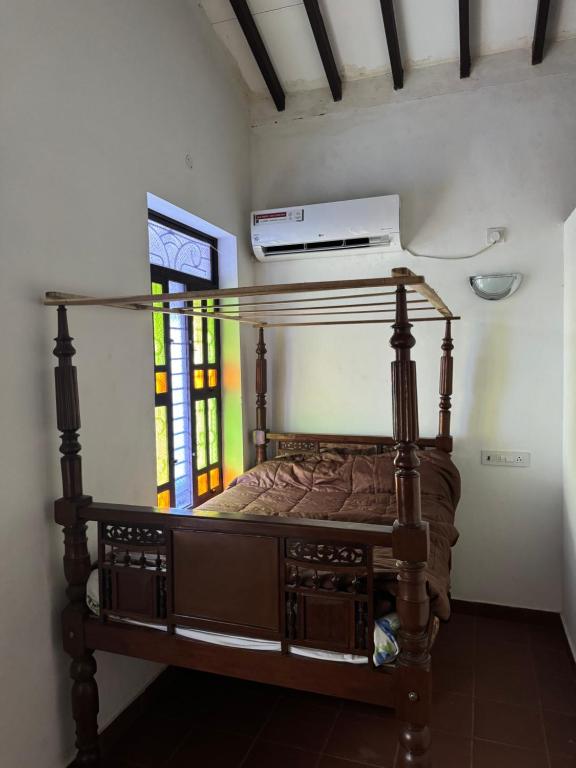Postel nebo postele na pokoji v ubytování Vittal Iyer House
