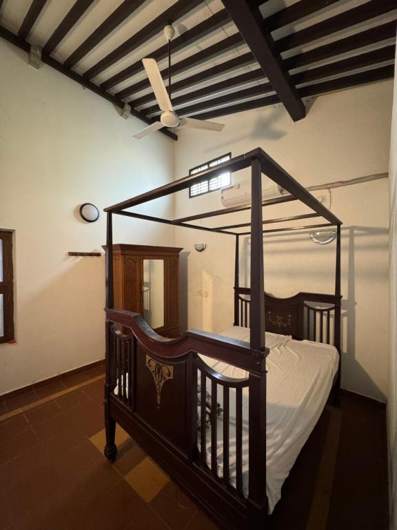 Postel nebo postele na pokoji v ubytování Vittal Iyer House