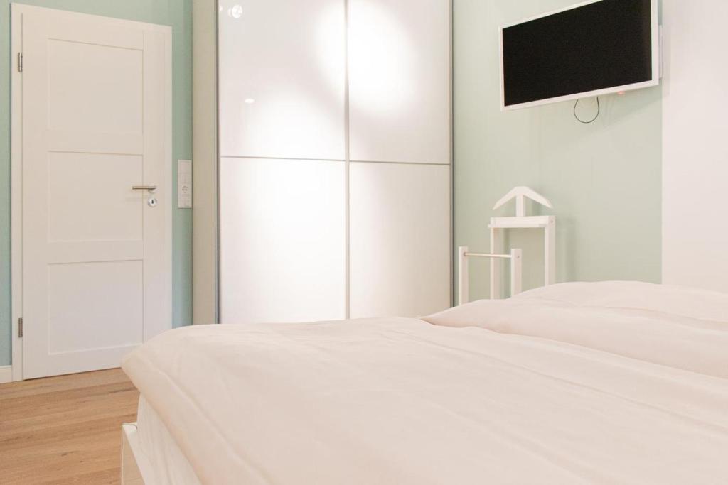 Postel nebo postele na pokoji v ubytování Ferienwohnung Nordwind