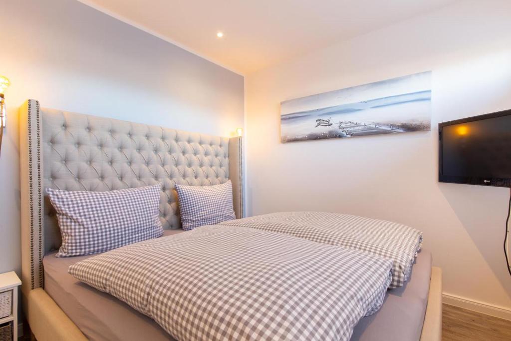 Postel nebo postele na pokoji v ubytování Ferienwohnung Aalkate App 1