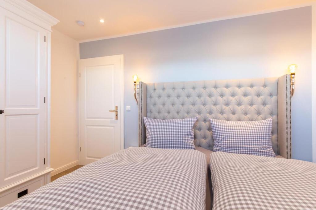 Postel nebo postele na pokoji v ubytování Ferienwohnung Aalkate App 1