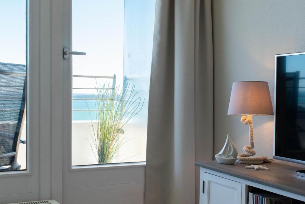 TV a/nebo společenská místnost v ubytování Ferienwohnung Residenz App 149 - Timmendorfer Strand