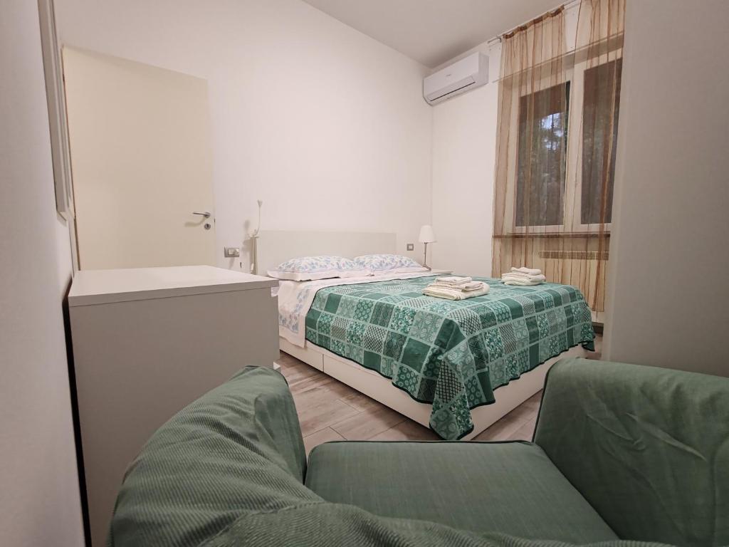 Postel nebo postele na pokoji v ubytování Fiera ILYM
