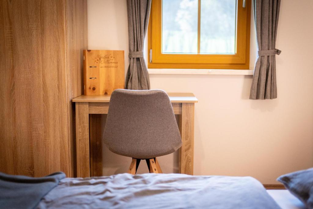 Postel nebo postele na pokoji v ubytování Alpen Appartements Oberlehengut