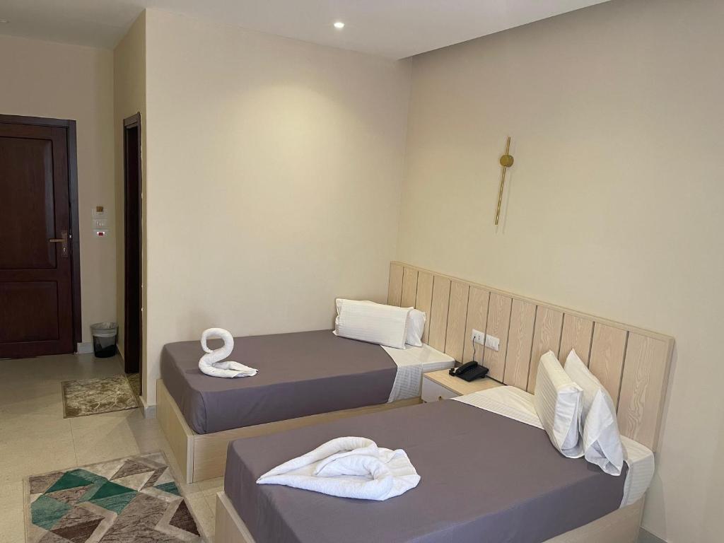 Postel nebo postele na pokoji v ubytování City View Palace hotel