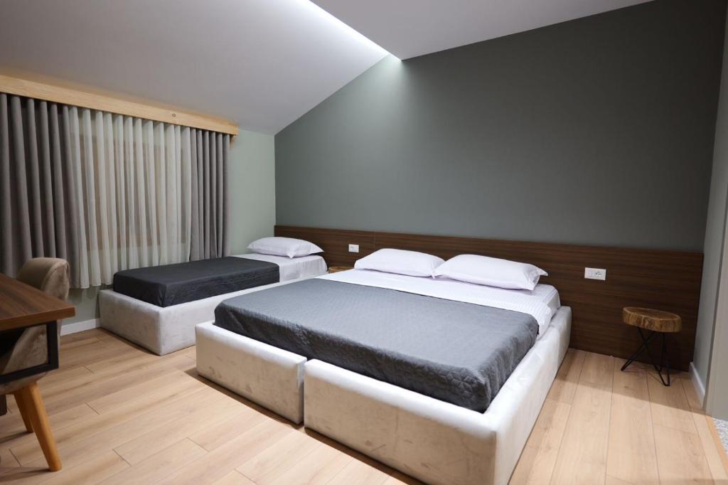 Postel nebo postele na pokoji v ubytování Hotel Ikona